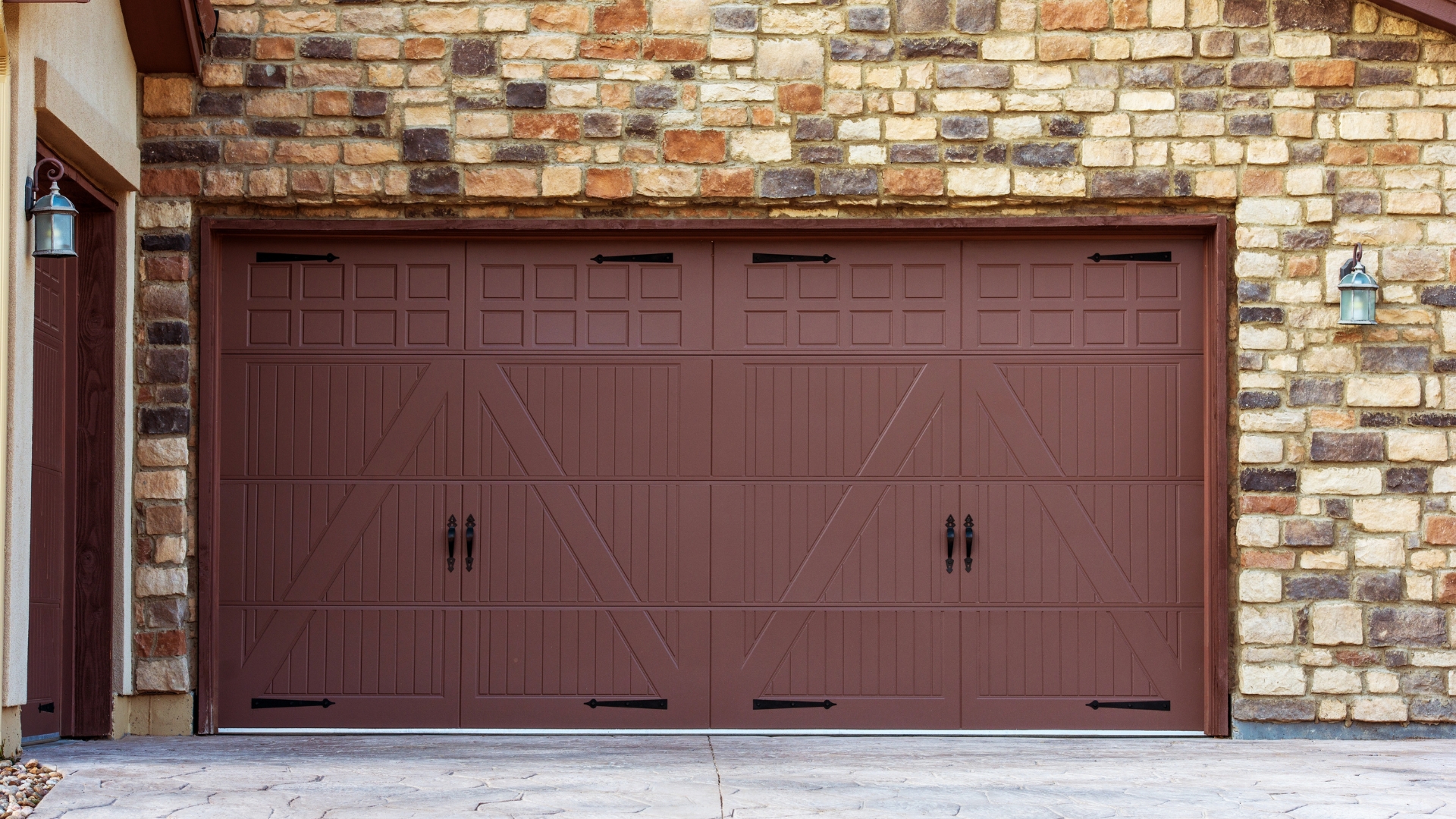 A garage door with magnetic decorative hardware