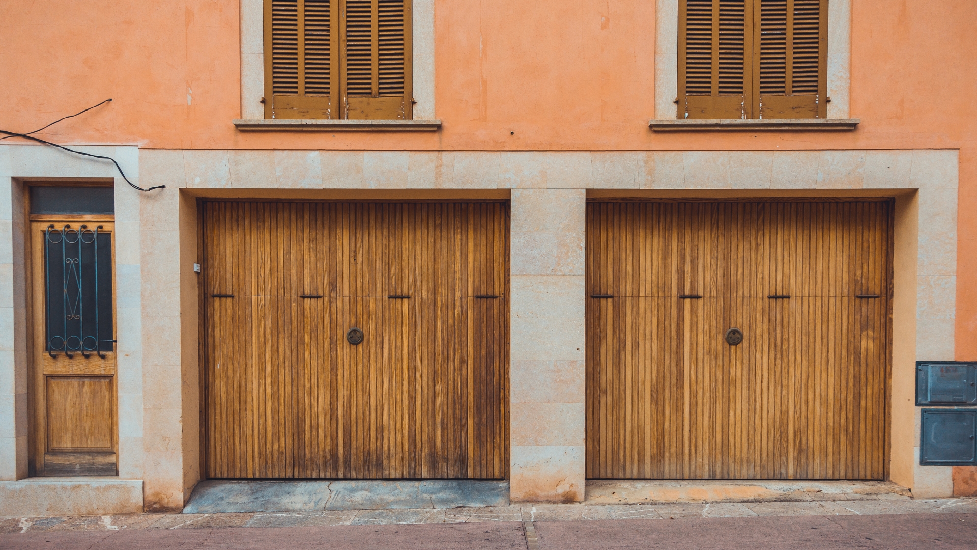 Garage doors with pull ring decorative hardware