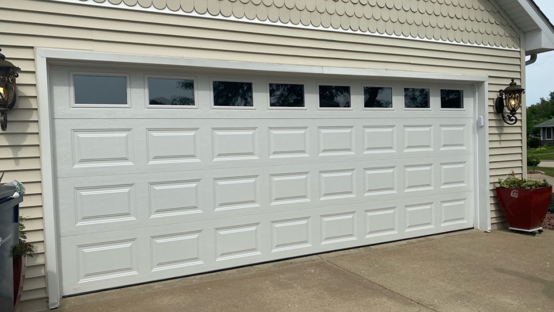 A two-car door with garage door windows