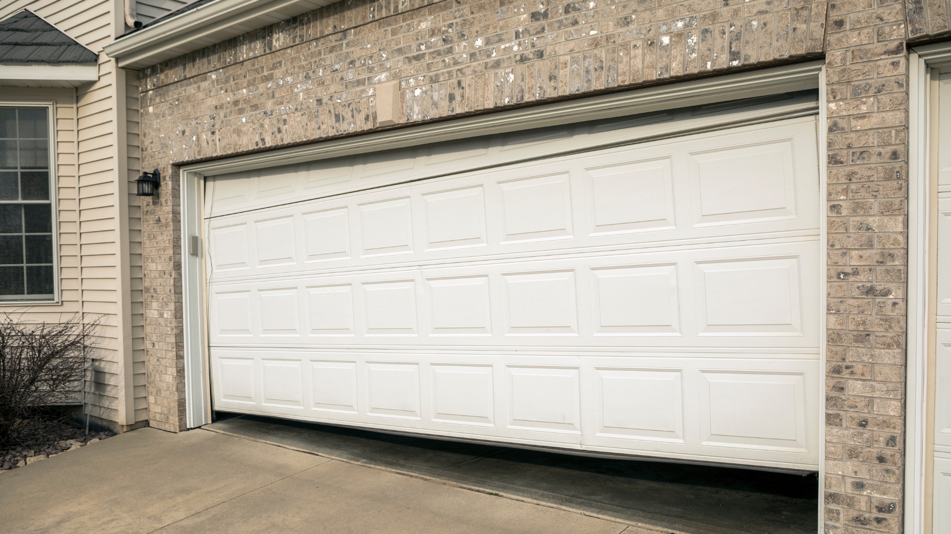 A house with misaligned garage doors