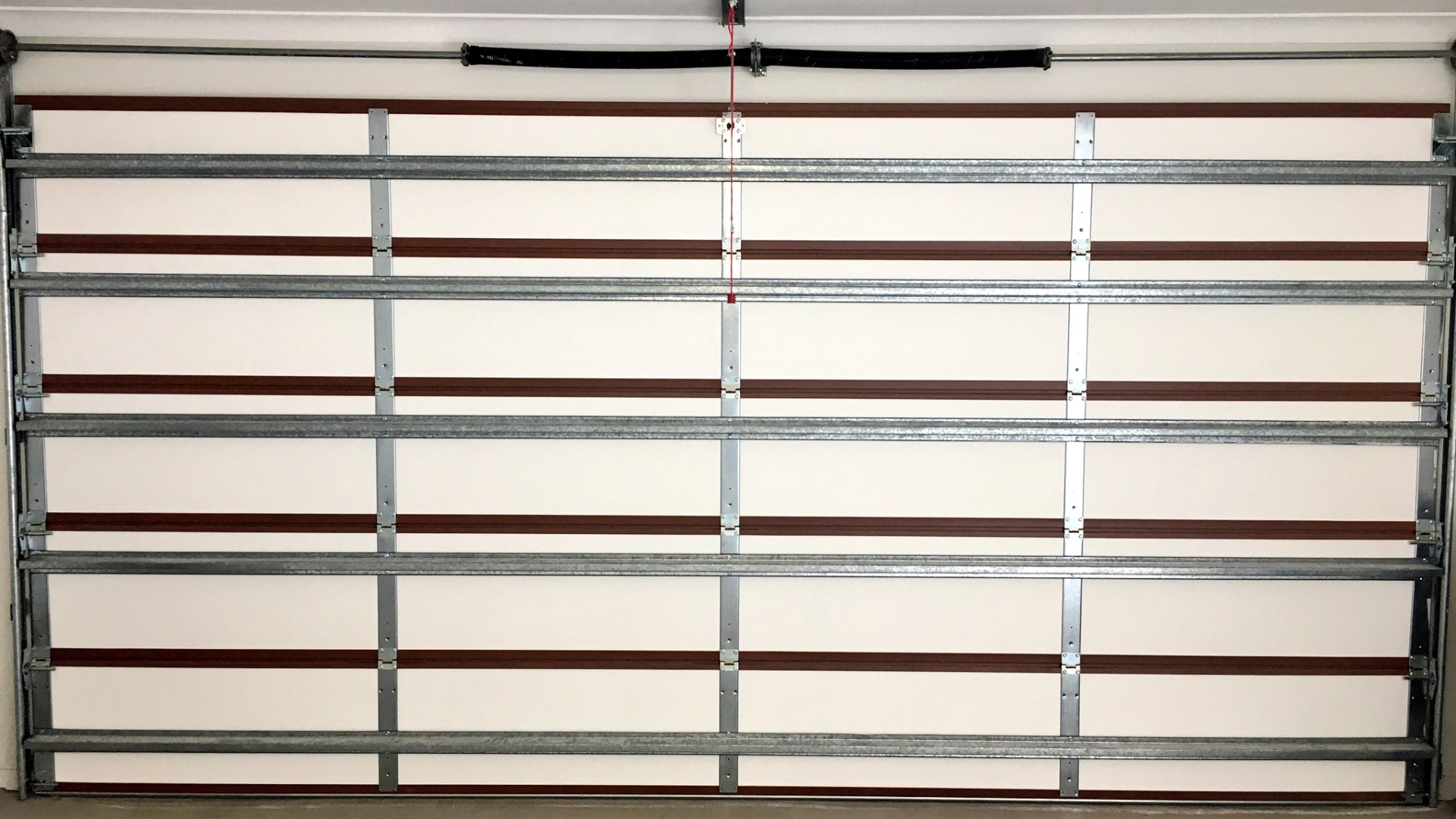 A door installed with garage door hurricane brace