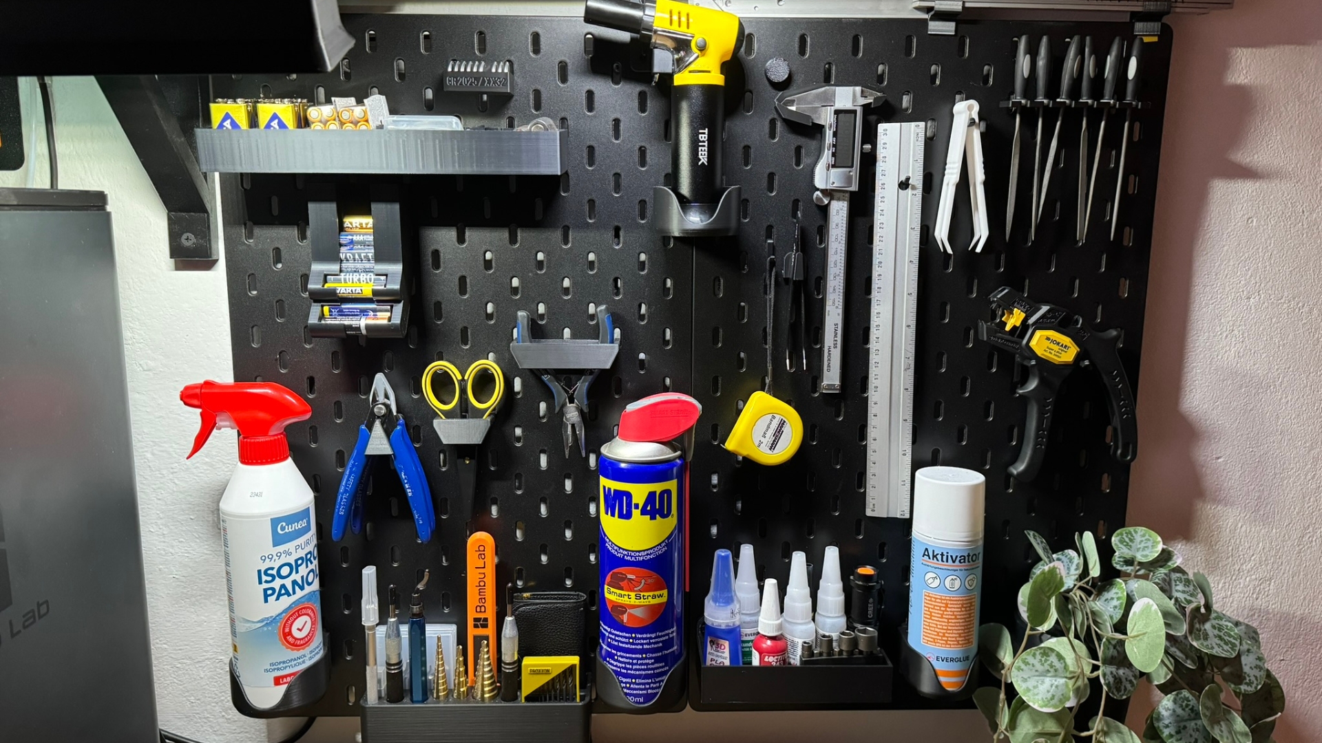 A black pegboard and hooks as an affordable garage storage solution