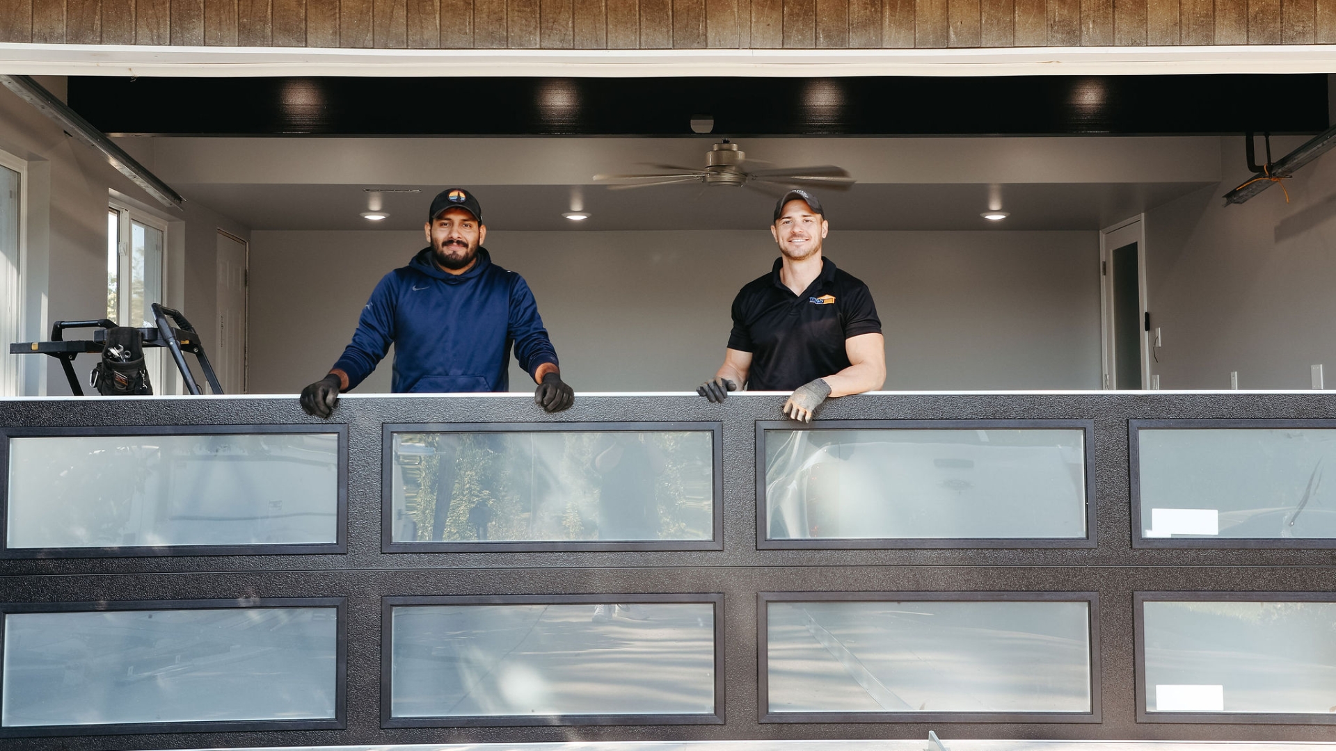 Two garage door repair experts from Titan Garage Doors NE