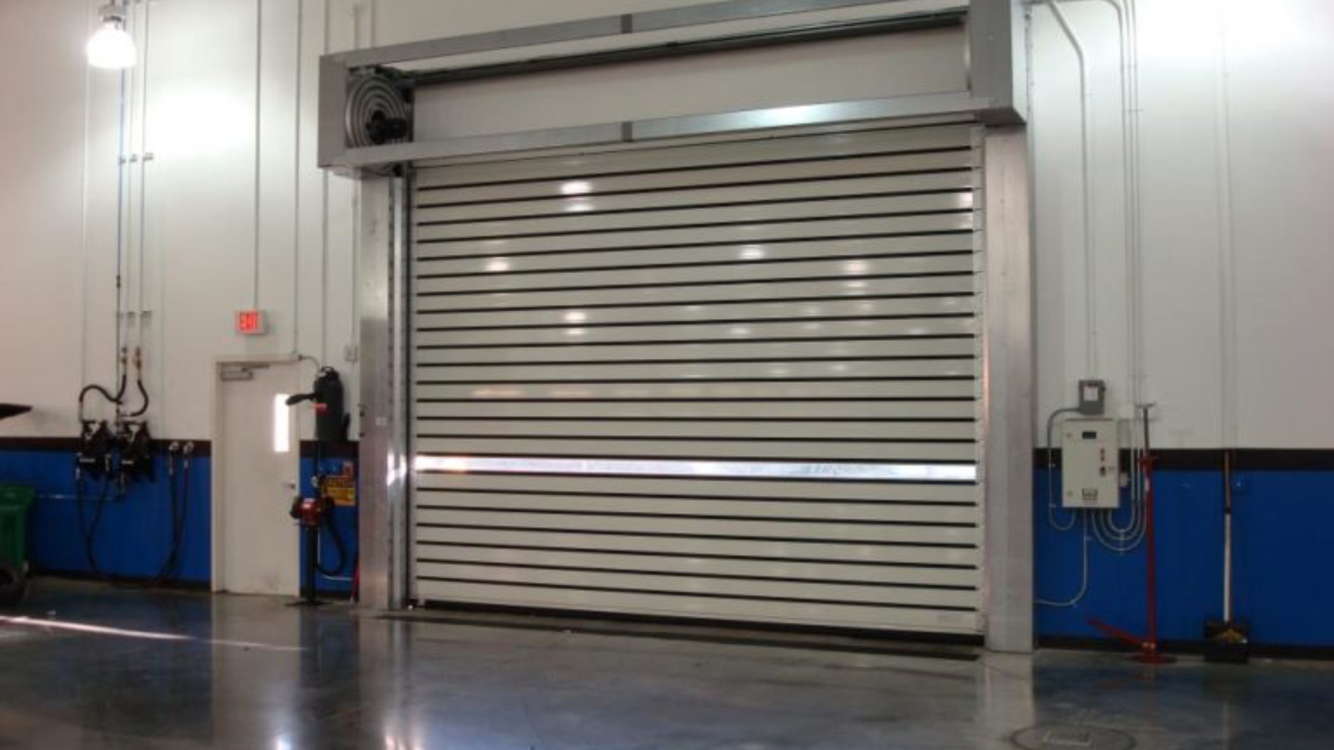 Industrial workspace with high-speed rolling doors for uninterrupted business operation.