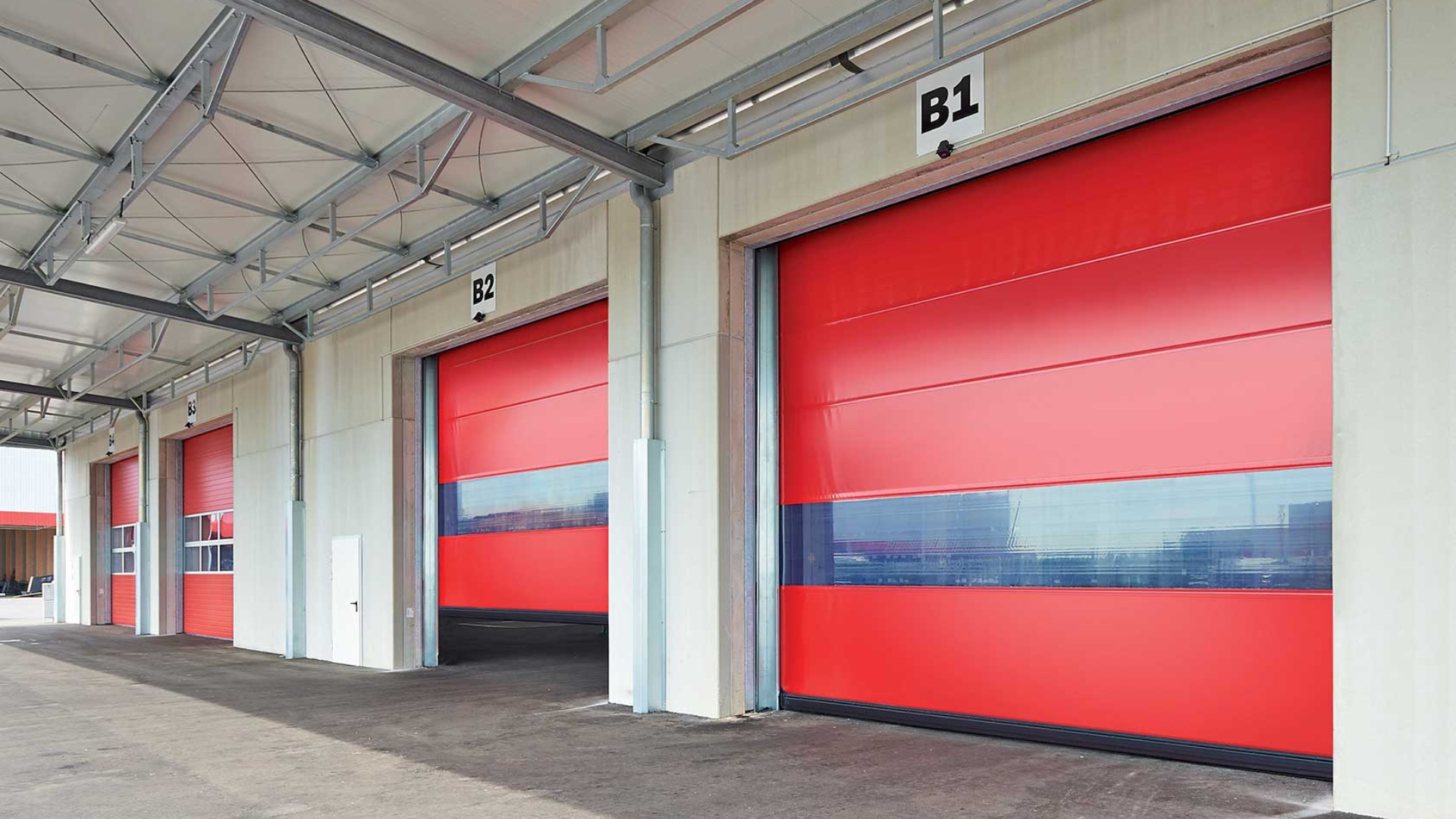 A facility with high-speed roll-up doors designed for efficient loading and unloading.