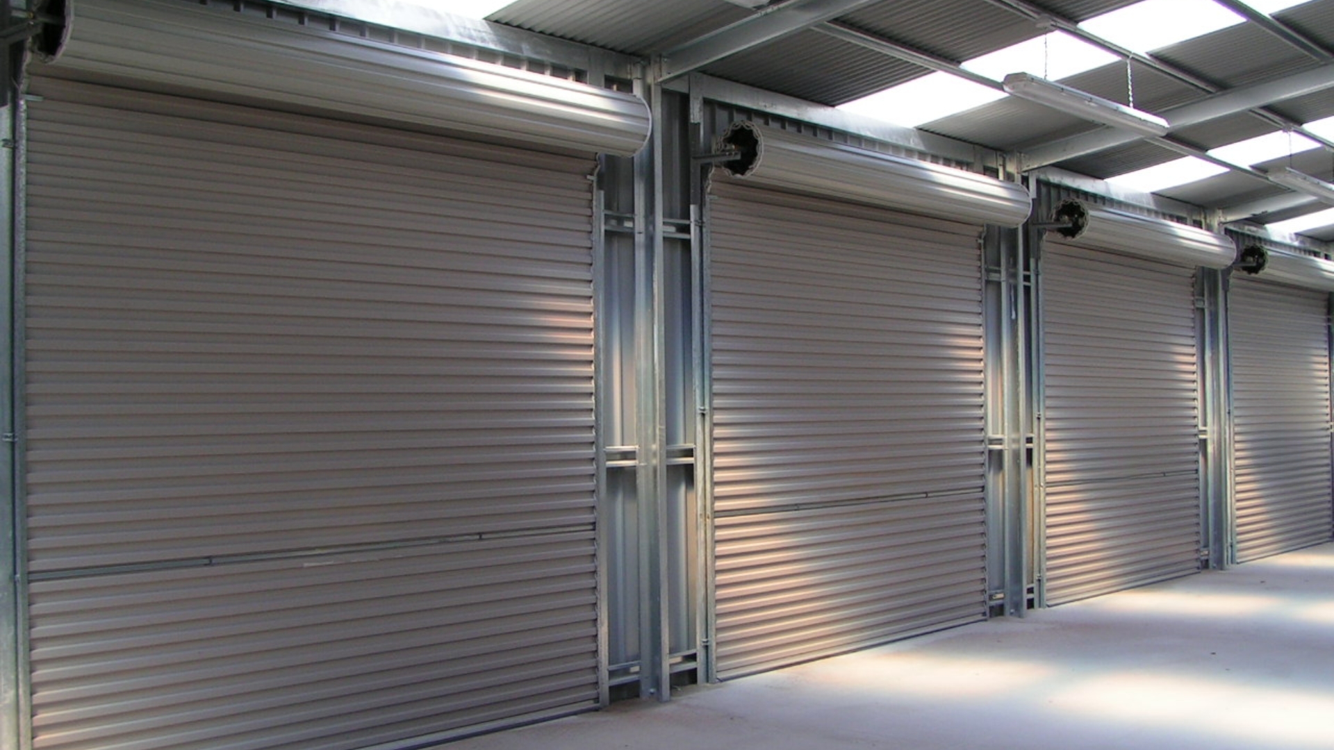 A row of industrial roller doors providing safety and easy access.